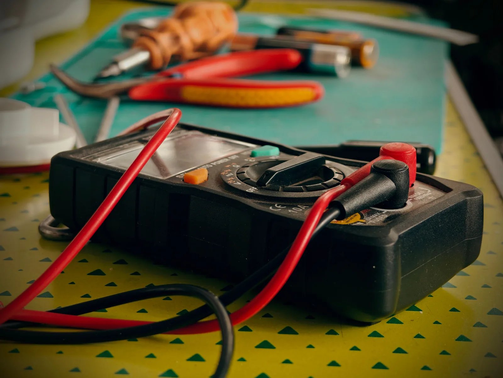 A multimeter and hand tools ready for a diagnostic visit, for electrician in Windsor