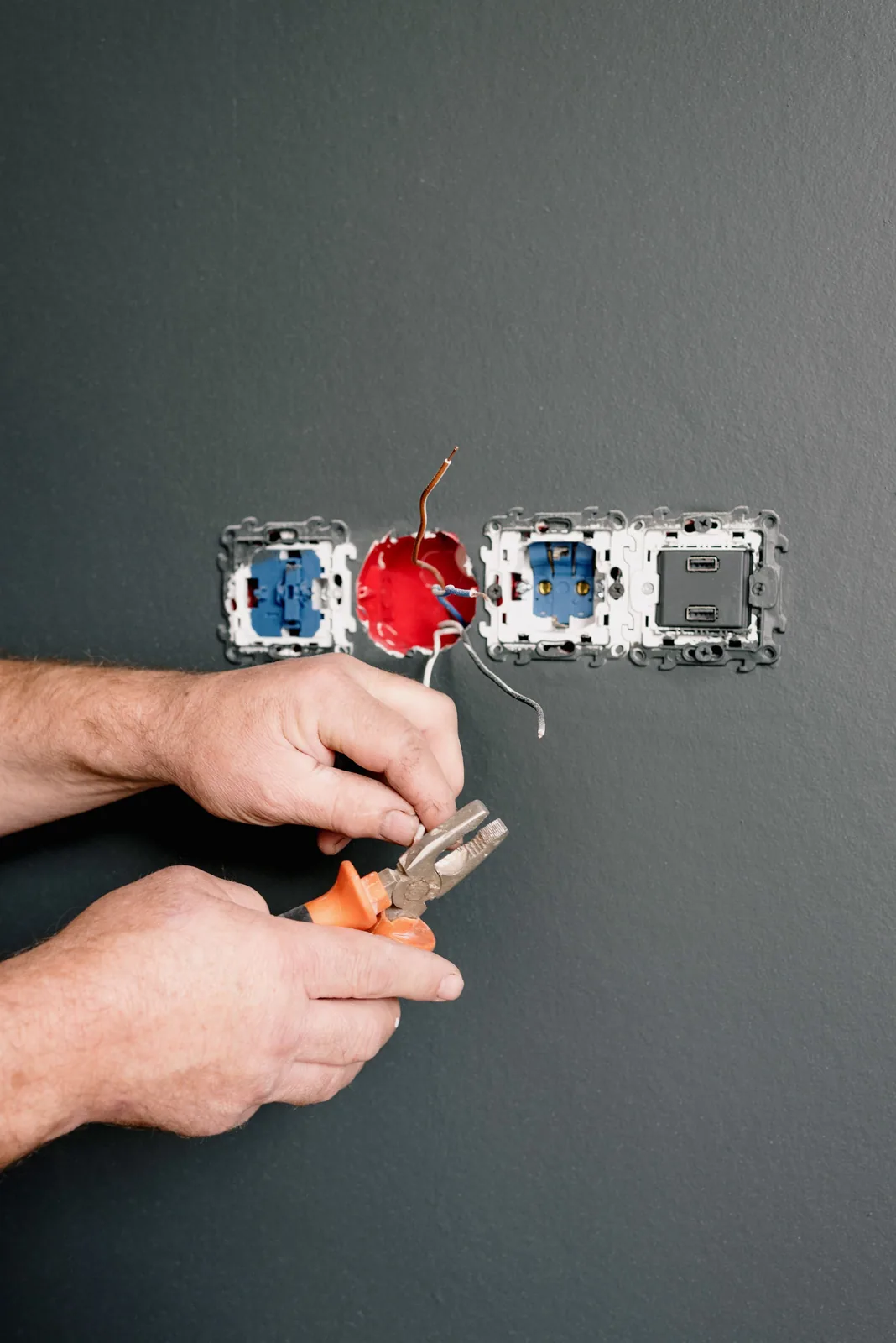 Wiring an outlet box into a finished wall, for code violation in Windsor
